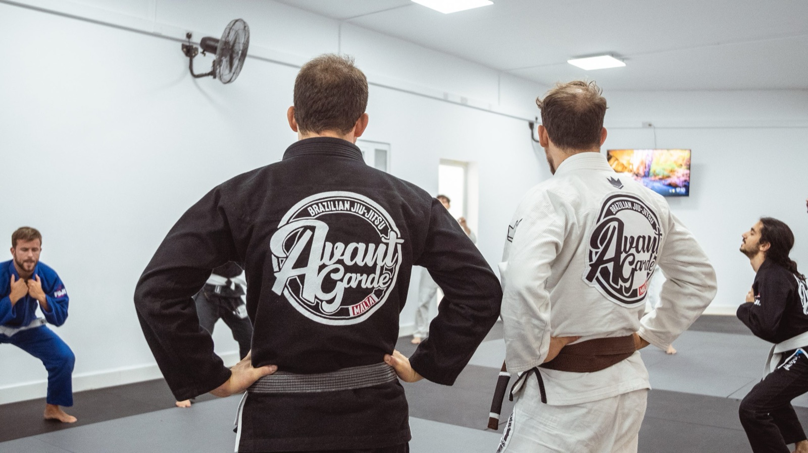 Adults lining up in gis at Avant-Garde BJJ